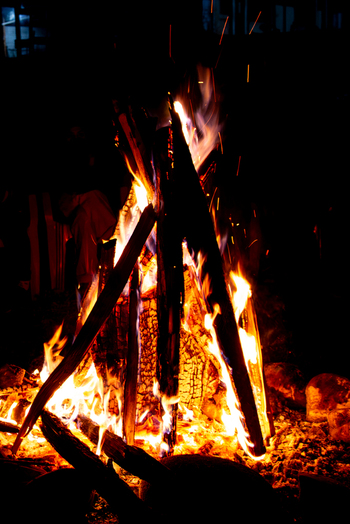 View of a bright bonfire with burning logs and glowing sparks at night in Arang Kel Kashmir Pakistan. View of a bright bonfire with burning logs and glowing sparks at night in Arang Kel Kashmir Pakistan.