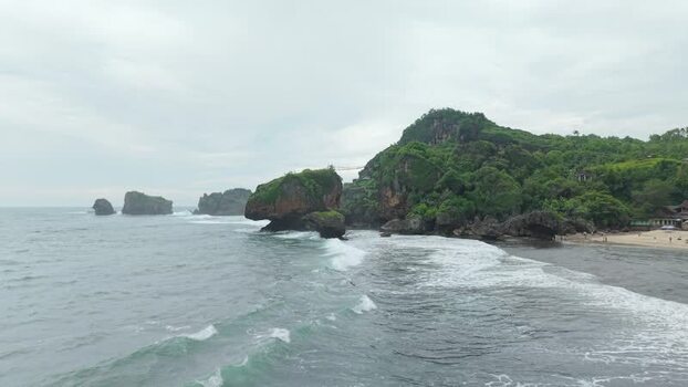 Aerial view of Siung Beach and rocky cliffs Indonesia.