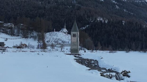 Aerial view of the sunken church tower in Graun im Vinschgau Italy. Aerial view of the sunken church tower in Graun im Vinschgau Italy.