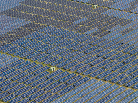 Aerial view of the solar field at the former military airfield Preschen with rows of photovoltaic panels covering the historic runway and taxiway in Neisse Malxetal Brandenburg Germany. Aerial view of the solar field at the former military airfield Preschen with rows of photovoltaic panels covering the historic runway and taxiway in Neisse Malxetal Brandenburg Germany.