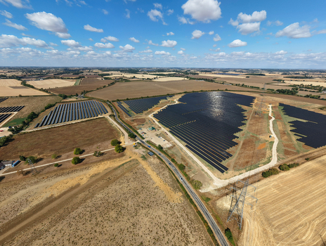 Aerial view of Eaton Socon Substation solar farm and battery energy storage systems surrounded by agricultural fields and rural landscape in St. Neots England United Kingdom. Aerial view of Eaton Socon Substation solar farm and battery energy storage systems surrounded by agricultural fields and rural landscape in St. Neots England United Kingdom.