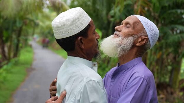 View of two elderly Muslim men greeting on a rural road Bangladesh. View of two elderly Muslim men greeting on a rural road Bangladesh.
