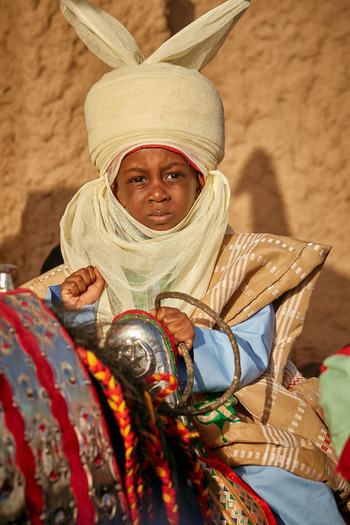 A young boy in traditional attire in Zaria Kaduna State Nigeria A young boy in traditional attire in Zaria Kaduna State Nigeria
