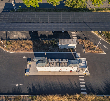 Aerial view of a Battery Energy Storage System integrated with a solar photovoltaic carport supporting renewable energy storage in Le Pouzin Auvergne Rhone Alpes France. Aerial view of a Battery Energy Storage System integrated with a solar photovoltaic carport supporting renewable energy storage in Le Pouzin Auvergne Rhone Alpes France.