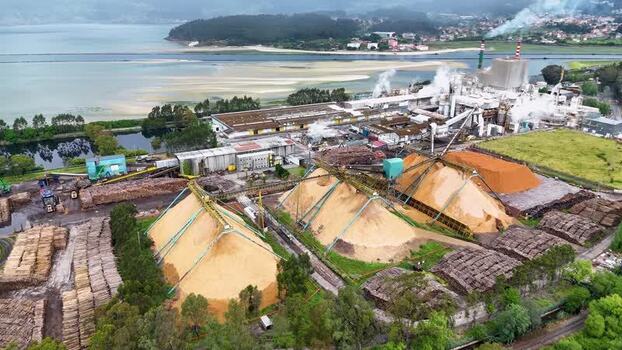 Aerial view of the Ence pulp mill and wood chip piles Spain. Aerial view of the Ence pulp mill and wood chip piles Spain.