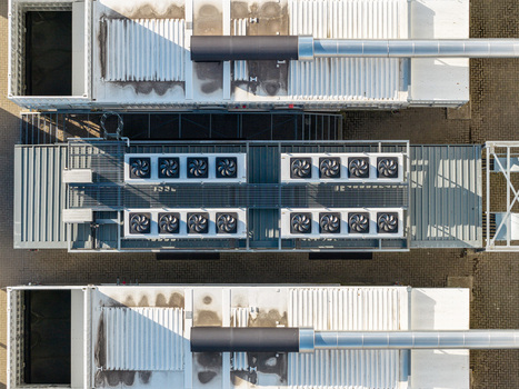 Aerial view of Vantage Data Centers BER1 featuring industrial cooling units and ventilation systems on the roof in Ludwigsfelde Brandenburg Germany. Aerial view of Vantage Data Centers BER1 featuring industrial cooling units and ventilation systems on the roof in Ludwigsfelde Brandenburg Germany.