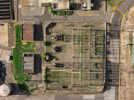 Aerial view of an electrical substation with transformers and power lines situated within the industrial zone of Bajos de Haina San Cristobal Provinc Dominican Republic.