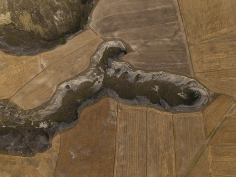 Aerial view of the Toachi River Canyon winding through dry agricultural fields and rugged terrain in Zumbahua Cotopaxi Ecuador. Aerial view of the Toachi River Canyon winding through dry agricultural fields and rugged terrain in Zumbahua Cotopaxi Ecuador.