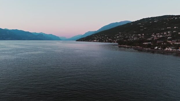 Aerial view of Lake Garda and shoreline at dusk Italy. Aerial view of Lake Garda and shoreline at dusk Italy.