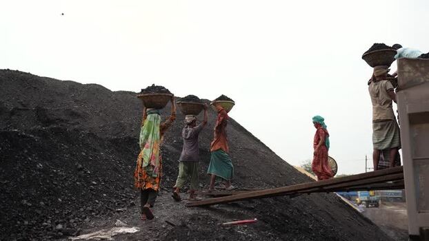 View of workers carrying coal baskets at Aminbazar Bangladesh.