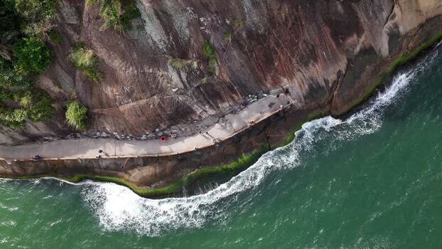 Aerial view of the rocky coastline at Praia do Leme Brazil.