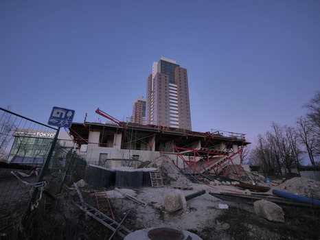 Riga Latvia 03 April 2025 View of Panorama Plaza high rise buildings towering over a construction site with scaffolding and building materials at dusk. Riga Latvia 03 April 2025 View of Panorama Plaza high rise buildings towering over a construction site with scaffolding and building materials at dusk.