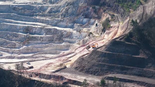 Aerial view of a quarry with heavy machinery France.