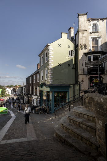 Durham England United Kingdom 13 July 2026 View of a historic street in Durham with a green building stone steps and people walking on a sunny day. Durham England United Kingdom 13 July 2026 View of a historic street in Durham with a green building stone steps and people walking on a sunny day.