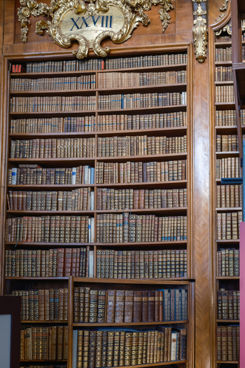Wien Austria 26 April 2026 View of the historic bookshelves in the Austrian National Library with antique leather bound volumes and ornate golden baroque decorations. Wien Austria 26 April 2026 View of the historic bookshelves in the Austrian National Library with antique leather bound volumes and ornate golden baroque decorations.