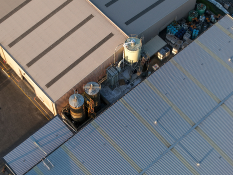 Kilsyth VIC Australia 22 September 2026 Aerial view of industrial factory buildings featuring metal rooftops large storage silos and outdoor storage areas. Kilsyth VIC Australia 22 September 2026 Aerial view of industrial factory buildings featuring metal rooftops large storage silos and outdoor storage areas.