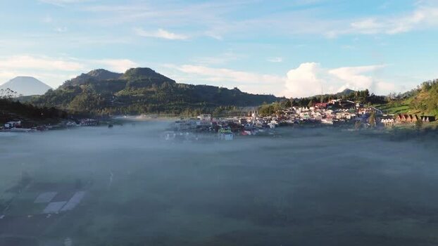 Aerial view of Dieng Plateau village in morning mist Indonesia. Aerial view of Dieng Plateau village in morning mist Indonesia.