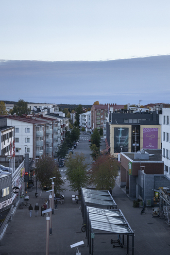 Rovaniemi Finland 19 September 2026 Aerial view of Rovaniemi city center with modern buildings pedestrian walkways street trees and people walking along the street.