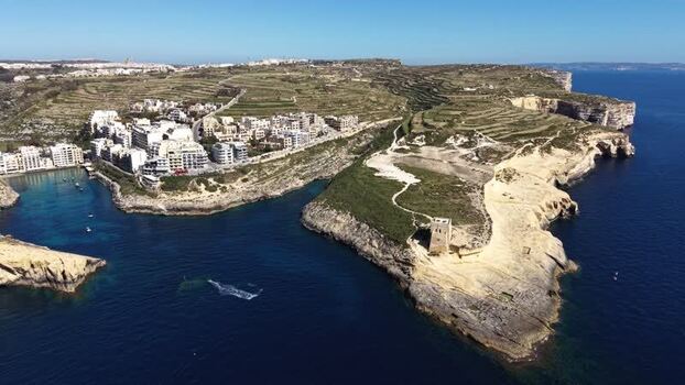 Aerial view of Xlendi Bay and the historic watchtower Malta. Aerial view of Xlendi Bay and the historic watchtower Malta.