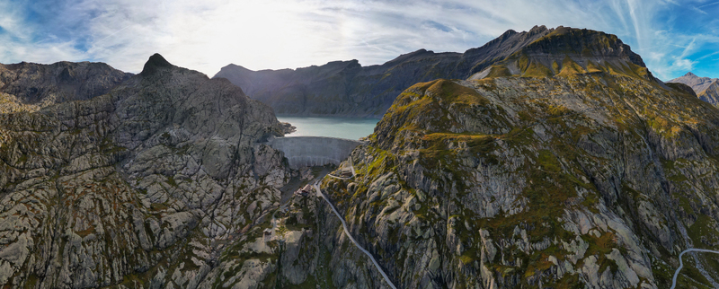 Aerial view of the Vieux Emosson Dam and lake surrounded by rugged rocky mountain peaks and alpine landscape in Finhaut Valais Switzerland. Aerial view of the Vieux Emosson Dam and lake surrounded by rugged rocky mountain peaks and alpine landscape in Finhaut Valais Switzerland.