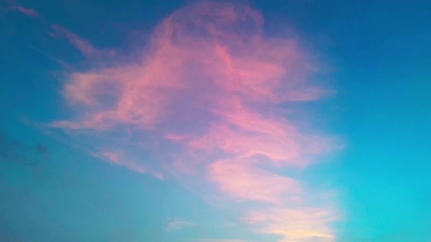 Aerial view of pink clouds in a blue sky over Surat India.