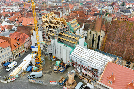 Aerial view of Rathaus Forchheim under renovation with scaffolding and a yellow crane in the historic old town square Forchheim Bayern Germany. Aerial view of Rathaus Forchheim under renovation with scaffolding and a yellow crane in the historic old town square Forchheim Bayern Germany.