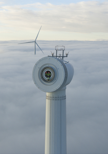 Netherlands 26 November 2025 Aerial view of workers inside a wind turbine nacelle rising above a thick layer of clouds under a soft sky. Netherlands 26 November 2025 Aerial view of workers inside a wind turbine nacelle rising above a thick layer of clouds under a soft sky.