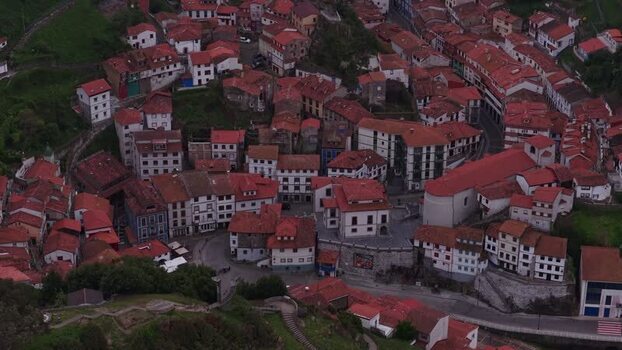Aerial view of the colorful houses and red rooftops of Cudillero Spain. Aerial view of the colorful houses and red rooftops of Cudillero Spain.