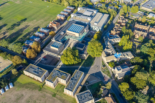Aerial view of the modern research and data center facilities at Oxford University featuring large buildings surrounding green spaces and nearby streets in Oxford England United Kingdom. Aerial view of the modern research and data center facilities at Oxford University featuring large buildings surrounding green spaces and nearby streets in Oxford England United Kingdom.