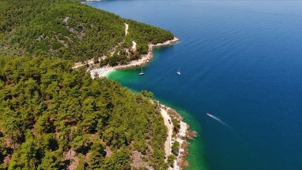 Aerial view of the coastline and turquoise waters in Thasos Greece. Aerial view of the coastline and turquoise waters in Thasos Greece.