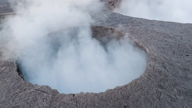 Aerial view of Erta Ale Volcano crater with steam in Afar Ethiopia. Aerial view of Erta Ale Volcano crater with steam in Afar Ethiopia.