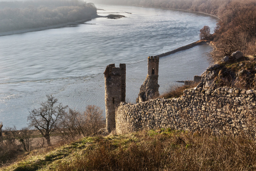 View of the historic ruins of Devin Castle with its ancient stone towers and walls overlooking the river confluence in Bratislava IV Bratislava Region Slovakia. View of the historic ruins of Devin Castle with its ancient stone towers and walls overlooking the river confluence in Bratislava IV Bratislava Region Slovakia.