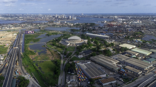Aerial view of the Wole Soyinka Centre for Culture and Creative Arts National Theatre Nigeria surrounded by greenery and the city skyline Lagos Lagos Nigeria.