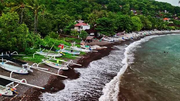Aerial view of traditional boats on a beach in Bali Indonesia.