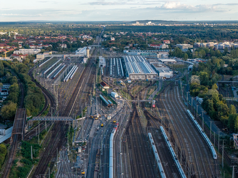 Berlin Germany 20 September 2026 Aerial view of ICE Werk Berlin Rummelsburg with extensive railway tracks maintenance halls and parked high speed trains under a clear sky. Berlin Germany 20 September 2026 Aerial view of ICE Werk Berlin Rummelsburg with extensive railway tracks maintenance halls and parked high speed trains under a clear sky.