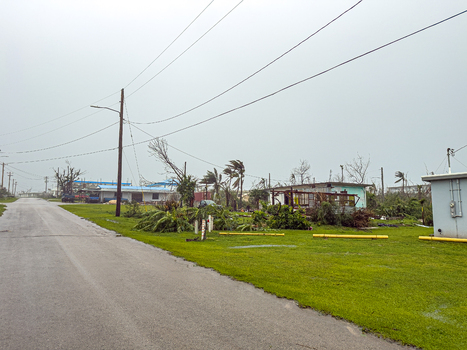San Jose Tinian Northern Mariana Islands 06 July 2026 View of storm damage caused by a typhoon with fallen trees debris and overcast skies in a residential area. San Jose Tinian Northern Mariana Islands 06 July 2026 View of storm damage caused by a typhoon with fallen trees debris and overcast skies in a residential area.