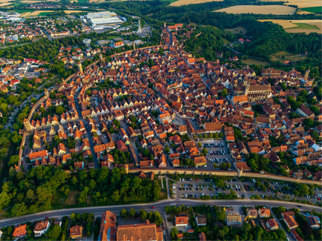 Aerial view of the historic medieval town of Rothenburg ob der Tauber with red tiled rooftops ancient city walls and greenery in Rothenburg ob der Tauber Bavaria Germany. Aerial view of the historic medieval town of Rothenburg ob der Tauber with red tiled rooftops ancient city walls and greenery in Rothenburg ob der Tauber Bavaria Germany.