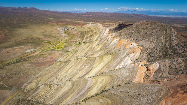 Aerial view of the Gigantes Dormidos geological formation showcasing vibrant sedimentary rock layers and rugged desert terrain in Tres Cruces Jujuy Province Argentina. Aerial view of the Gigantes Dormidos geological formation showcasing vibrant sedimentary rock layers and rugged desert terrain in Tres Cruces Jujuy Province Argentina.