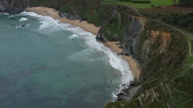 Aerial view of the rugged cliffs and sandy beach in Loiba Spain. Aerial view of the rugged cliffs and sandy beach in Loiba Spain.