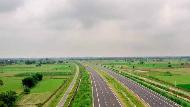 Aerial view of highway through rural landscape in India. Aerial view of highway through rural landscape in India.
