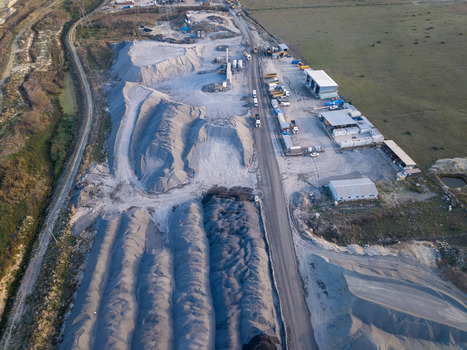 Aerial view of an industrial quarry site with large piles of gravel and sand heavy machinery and storage facilities in Istanbul Istanbul Turkiye.