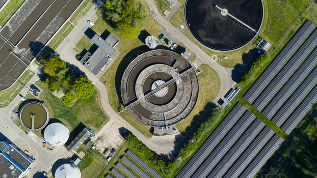 Aerial view of the RWZI Echten water treatment plant featuring circular sedimentation tanks and extensive solar panel arrays Hoogeveen Drenthe Netherlands. Aerial view of the RWZI Echten water treatment plant featuring circular sedimentation tanks and extensive solar panel arrays Hoogeveen Drenthe Netherlands.