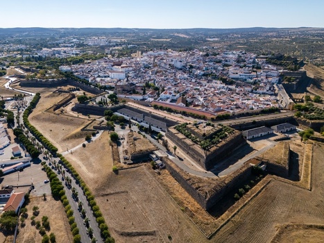 Aerial view of the historic star shaped fortifications and white washed buildings of the Garrison Border Town of Elvas surrounded by dry landscape Elvas Portalegre Portugal. Aerial view of the historic star shaped fortifications and white washed buildings of the Garrison Border Town of Elvas surrounded by dry landscape Elvas Portalegre Portugal.