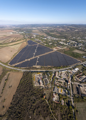 Aerial view of a large solar farm with rows of photovoltaic panels situated in the rural landscape near Lovech Lovech Bulgaria. Aerial view of a large solar farm with rows of photovoltaic panels situated in the rural landscape near Lovech Lovech Bulgaria.