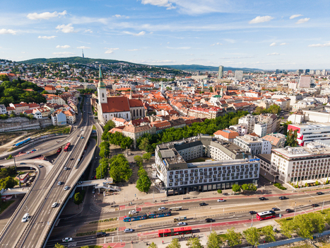 Aerial view of St. Martin s Cathedral and the historic old town with red roofed buildings and city traffic in Bratislava Bratislava Region Slovakia. Aerial view of St. Martin s Cathedral and the historic old town with red roofed buildings and city traffic in Bratislava Bratislava Region Slovakia.