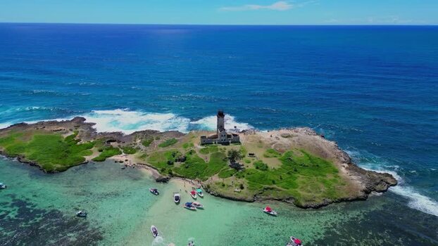 Aerial view of Ile aux Cerfs lighthouse and lagoon Mauritius.