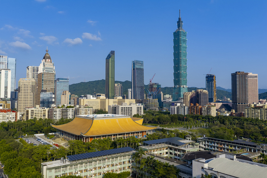 Aerial view of Taipei 101 skyscraper towering over the modern cityscape with lush greenery and traditional architecture in Taipei Taiwan. Aerial view of Taipei 101 skyscraper towering over the modern cityscape with lush greenery and traditional architecture in Taipei Taiwan.