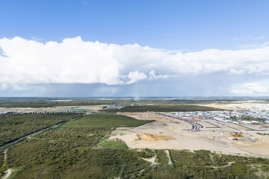 Aerial view of a residential development site under construction with cleared land new roads and surrounding bushland in Perth Western Australia Australia. Aerial view of a residential development site under construction with cleared land new roads and surrounding bushland in Perth Western Australia Australia.