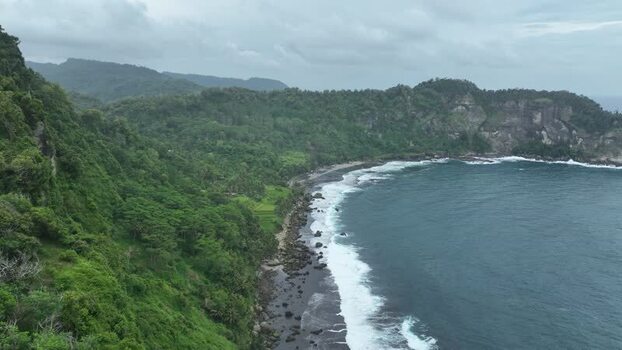 FPV aerial view of Pantai Pangasan coastline Indonesia.