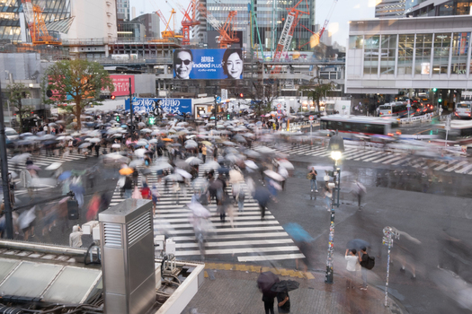 Tokyo Japan 01 October 2025 View of the iconic Shibuya Crossing alive with a blur of motion as pedestrians navigate the rain slicked zebra stripes under a sea of umbrellas. Tokyo Japan 01 October 2025 View of the iconic Shibuya Crossing alive with a blur of motion as pedestrians navigate the rain slicked zebra stripes under a sea of umbrellas.
